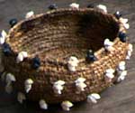 Muriel also makes baskets with shells sewn onto them.
