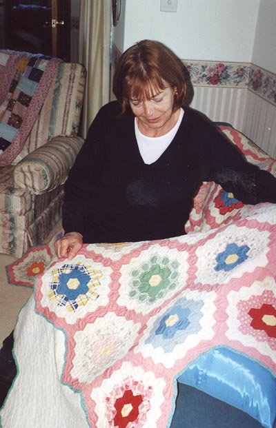 Muriel Thompson with quilt.