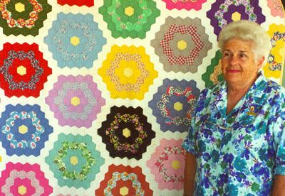 La Dona Anick with her grandmother's quilt. WA 2001