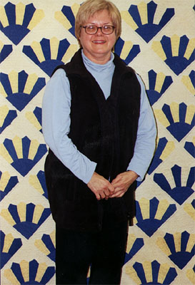 Donna Wood with her grandmother's quilt