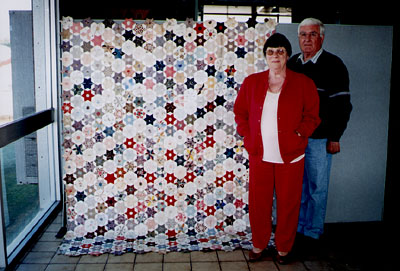 Shirley and Brian Gibb with Alice's quilt top.