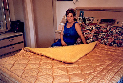 Yiota with her quilt