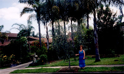 Yiota in front of her house 2002