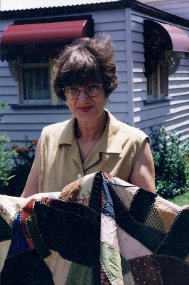 Owner, Bev Edmonds, with quilt