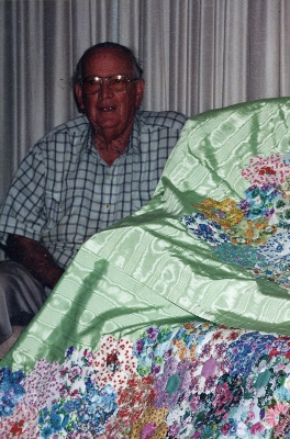 Bill Meynink with his mother's quilt