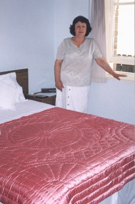 Maria Ahilas with her quilt, 2001