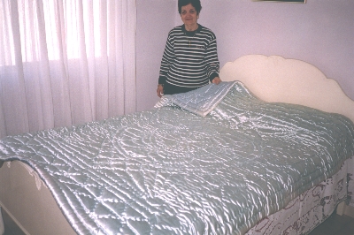 Nina Conomos with her daughter's quilt.