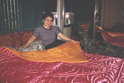 Nia Ikonomou and her quilt, 2000