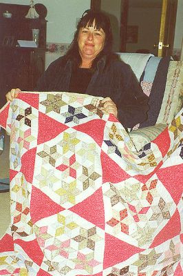 Alison Barlow with quilt.