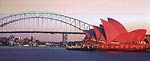 Two famous landmarks at sunset:<br>Sydney Harbour Bridge and the Opera House.